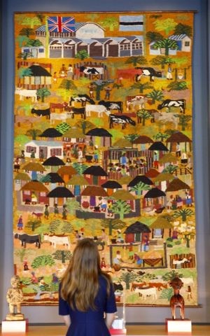 "A village scene" art piece presented to Britain's Queen Elizabeth II by Botswana's president, shown at Buckingham Palace in London on July 20, 2017, ahead of the forthcoming 'Royal Gifts' exhibition. (Tolga Akmen/AFP)