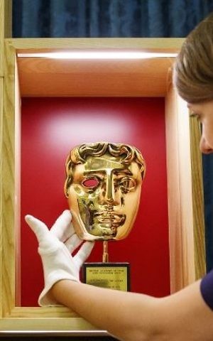 The Honorary BAFTA Award presented to actor Kenneth Branagh and given to Britain's Queen Elizabeth II in April 2013, pictured at Buckingham Palace in London on July 20, 2017, ahead of the forthcoming 'Royal Gifts' exhibition. (Tolga Akmen/AFP)