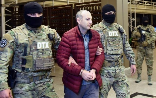 Israeli blogger Alexander Lapshin, upon his arrival in Baku after being extradited from Belarus to Azerbaijan, February 7, 2017. (AFP Photo/Tofik Babayev) Israeli blogger Alexander Lapshin, upon his arrival in Baku after being extradited from Belarus to Azerbaijan, February 7, 2017. (AFP Photo/Tofik Babayev)