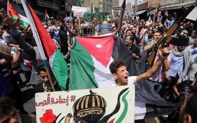 Jordanians shout slogans during a demonstration in Amman on July 21, 2017, protesting against new Israeli security measures implemented at the Temple Mount. (AFP/Khalil Mazraawi) Jordanians shout slogans during a demonstration in Amman on July 21, 2017, protesting against new Israeli security measures implemented at the Temple Mount. (AFP/Khalil Mazraawi)
