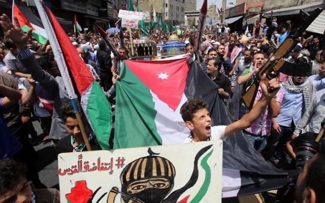 Jordanians shout slogans during a demonstration, called for by the Islamic Action Front, in Amman following Friday prayers on July 21, 2017, to protest against new Israeli security measures implemented at the Temple Mount. (AFP/ Khalil MAZRAAWI) Jordanians shout slogans during a demonstration, called for by the Islamic Action Front, in Amman following Friday prayers on July 21, 2017, to protest against new Israeli security measures implemented at the Temple Mount. (AFP/ Khalil MAZRAAWI)
