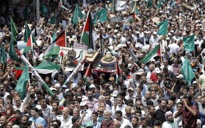 Jordanians carry a model of the Dome of the Rock mosque during a demonstration in Amman against new Israeli security measures at the Temple Mount on July 21, 2017. (AFP Photo/Khalil Mazraawi)
