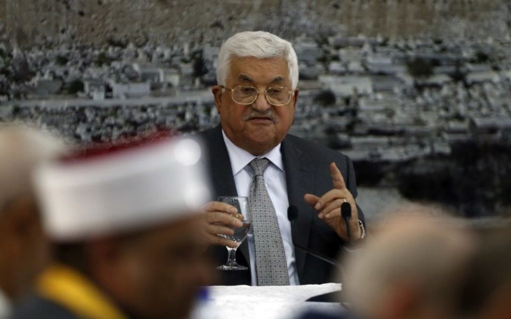 Palestinian Authority President Mahmoud Abbas gives a speech during a meeting of Palestinian leadership in the West Bank city of Ramallah on July 21, 2017, during which he announced freezing all contacts with Israel. (AFP/Abbas Momani)