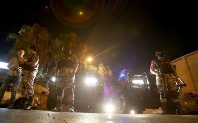 Security forces stand guard outside the Israeli Embassy in the residential Rabiyeh neighborhood of the Jordanian capital Amman on July 23, 2017. (AFP/Khalil Mazraawi)