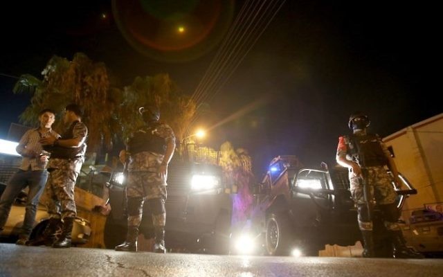 Security forces stand guard outside the Israeli Embassy in the residential Rabiyeh neighborhood of the Jordanian capital Amman on July 23, 2017. (AFP/Khalil Mazraawi) Security forces stand guard outside the Israeli Embassy in the residential Rabiyeh neighborhood of the Jordanian capital Amman on July 23, 2017. (AFP/Khalil Mazraawi)