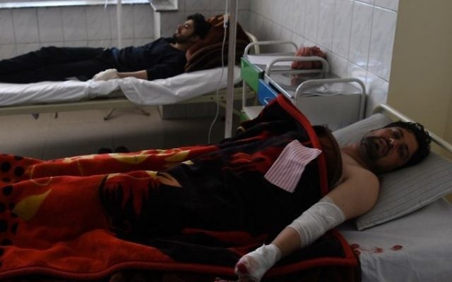 Afghan men, at a hospital, after being injured in a car bomb attack in Kabul on July 24, 2017. (AFP Photo/Shah Marai) Afghan men, at a hospital, after being injured in a car bomb attack in Kabul on July 24, 2017. (AFP Photo/Shah Marai)