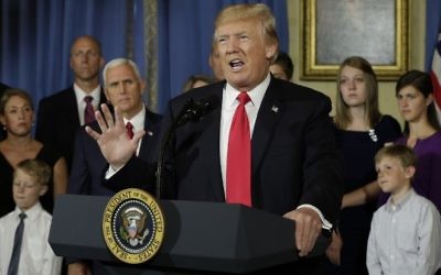 US President Donald Trump delivers s statement on health care in front of alleged "victims of Obamacare" at the White House in Washington on July 24, 2017. (AFP/Yuri Gripas)