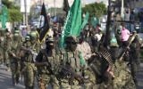 Palestinian members of the Izz ad-Din al-Qassam Brigades, the armed wing of the Hamas terror movement, take part in a military parade against Israel in Gaza City, July 25, 2017. (AFP/Mahmud Hams)