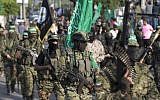 Terrorists from the military wing of the Hamas terror group take part in a parade against Israel in Gaza City on July 25, 2017. (AFP Photo/Mahmud Hams)
