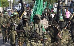 Terrorists from the military wing of the Hamas terror group take part in a parade against Israel in Gaza City on July 25, 2017. (AFP Photo/Mahmud Hams)