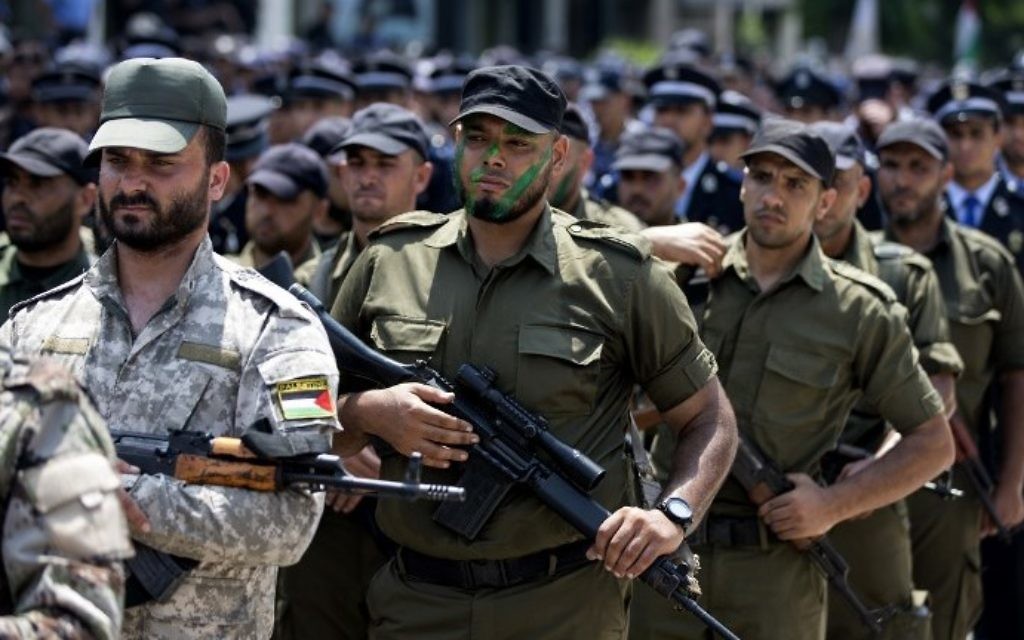 Illustrative: Members of Hamas's military branches take part in a military parade in Gaza City on July 26, 2017. (AFP Photo/Mahmud Hams)