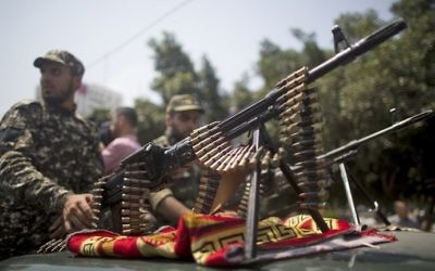Members of Palestinian forces loyal to Hamas take part in a military parade in Gaza City on July 26, 2017 amid a tense standoff is underway between Israel and Muslim worshipers at Jerusalem's Temple Mount compound. (AFP PHOTO / MAHMUD HAMS)