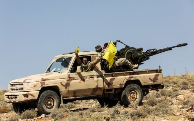 A picture taken on July 26, 2017 during a tour guided by the Lebanese terror group Hezbollah shows its members manning an anti-aircraft gun mounted on a pick-up truck in a mountainous area around the Lebanese town of Arsal along the border with Syria. (AFP Photo/Anwar Amro) A picture taken on July 26, 2017 during a tour guided by the Lebanese terror group Hezbollah shows its members manning an anti-aircraft gun mounted on a pick-up truck in a mountainous area around the Lebanese town of Arsal along the border with Syria. (AFP Photo/Anwar Amro)