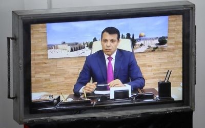 Exiled former senior Fatah member Mohammed Dahlan attends a Palestinian Legislative Council meeting in Gaza City through video conference from the United Arab Emirates on July 27, 2017. (AFP PHOTO / SAID KHATIB)