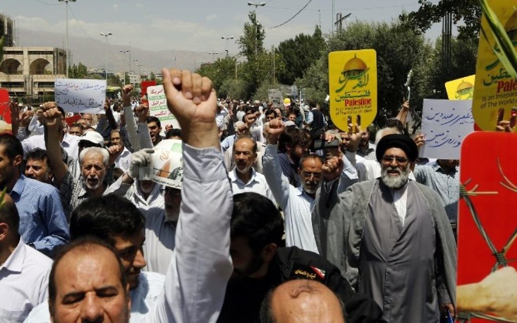 Iranians carry signs and chant anti-Israel slogans at a demonstration after Friday prayers in the capital Tehran on July 28, 2017 against Israeli security measures implemented at the Temple Mount compound in the Old City of Jerusalem. (AFP/Stringer)