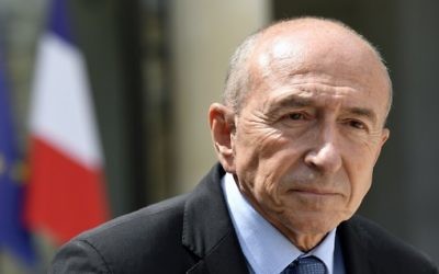 French Interior Minister Gerard Collomb leaves the Elysee Palace in Paris on July 28, 2017, after the weekly cabinet meeting. (AFP/Bertrand Guay)