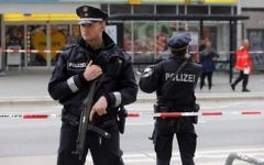 Police cordon off the area around a supermarket in the German city of Hamburg, where a man killed one person and wounded several others in a knife attack on July 28, 2017. (AFP Photo/dpa/Markus Scholz)