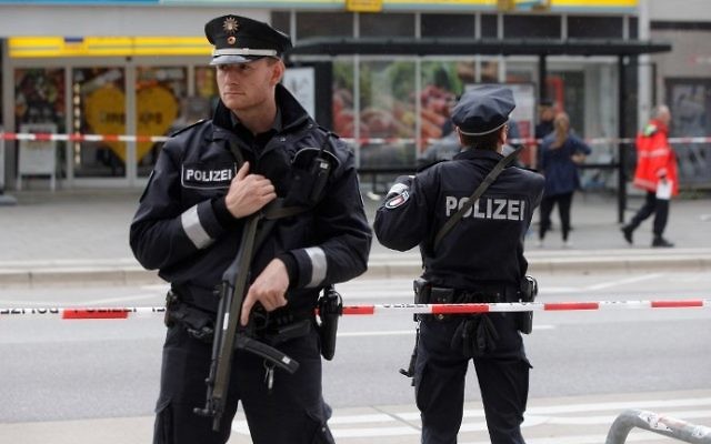 Police cordon off the area around a supermarket in the German city of Hamburg, where a man killed one person and wounded several others in a knife attack on July 28, 2017. (AFP Photo/dpa/Markus Scholz) Police cordon off the area around a supermarket in the German city of Hamburg, where a man killed one person and wounded several others in a knife attack on July 28, 2017. (AFP Photo/dpa/Markus Scholz)