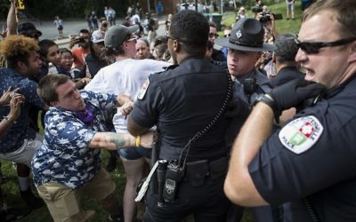 Officers clash with counter protesters after the Ku Klux Klan staged a protest on July 8, 2017 in Charlottesville, Virginia. (Chet Strange/Getty Images/AFP)