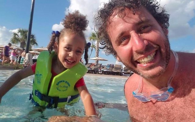 Ari Nagel having fun with one of his offspring. (Facebook)
