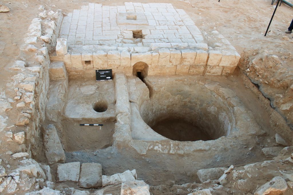 The wine press in Ramat Negev is intermeshed with a building, as seen in this summer 2017 photo. (Davida Dagan, Israel Antiquities Authority) The wine press in Ramat Negev is intermeshed with a building, as seen in this summer 2017 photo. (Davida Dagan, Israel Antiquities Authority)
