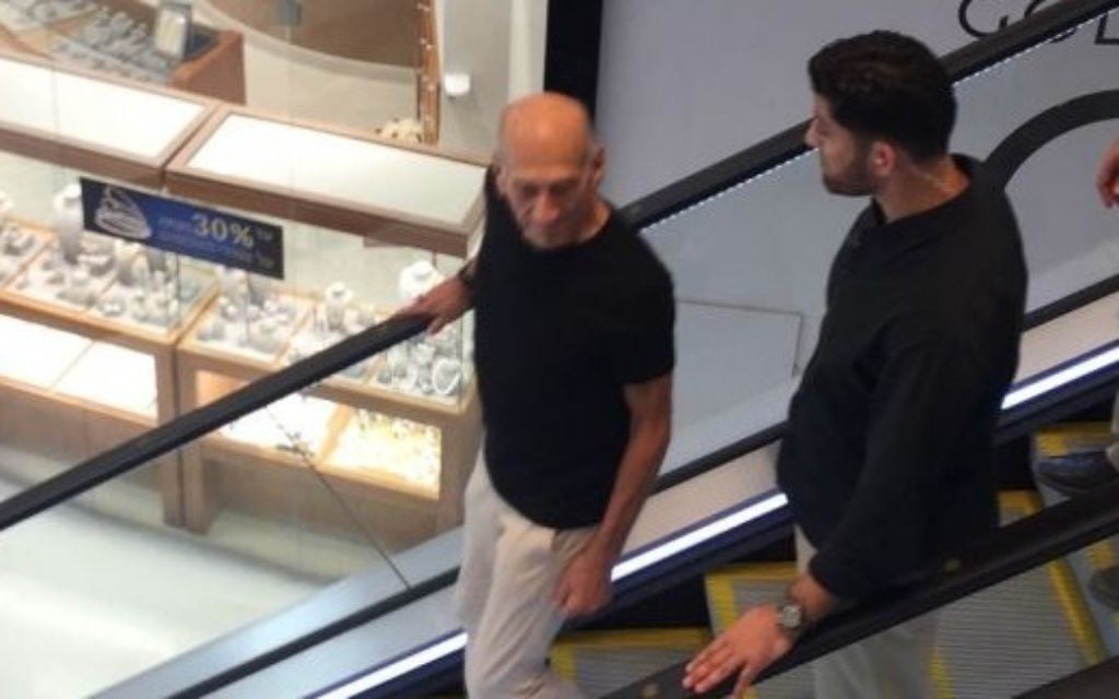 Former prime minister Ehud Olmert is seen shopping at TLV Fashion Mall in Tel Aviv on July 2, 2017, hours after being paroled from Matisyahu Prison. (courtesy)