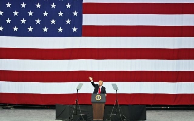 President Donald Trump waves as he addresses the scouts at the 2017 National Boy Scout Jamboree, July 24, 2017. (AP Photo/Steve Helber)