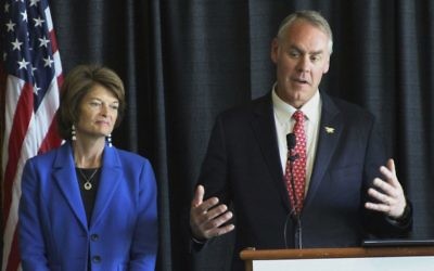 In this May 31, 2017, photo, Interior Secretary Ryan Zinke, right, with US Sen. Lisa Murkowski, R-Alaska, speaks during a news conference in Anchorage, Alaska. (AP Photo/Mark Thiessen)