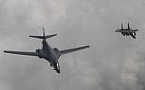 Illustrative: A US Air Force B-1B bomber, left, flies with a South Korean fighter jet F-15K over the Korean Peninsula, South Korea, Sunday, July 30, 2017 (South Korea Defense Ministry via AP)