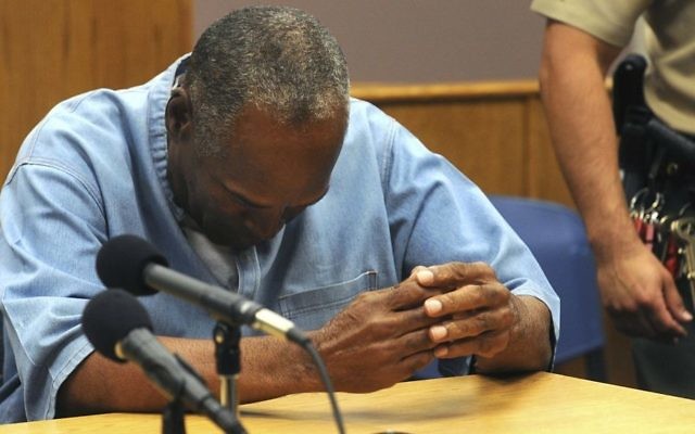 Former NFL football star O.J. Simpson reacts after learning he was granted parole at Lovelock Correctional Center in Lovelock, Nevada, July 20, 2017. (Jason Bean/The Reno Gazette-Journal via AP) Former NFL football star O.J. Simpson reacts after learning he was granted parole at Lovelock Correctional Center in Lovelock, Nevada, July 20, 2017. (Jason Bean/The Reno Gazette-Journal via AP)