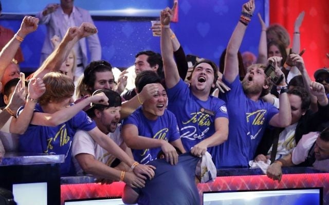 Fans celebrate after Scott Blumstein, bottom center, won the World Series of Poker main event, Sunday, July 23, 2017, in Las Vegas. (AP Photo/John Locher) 