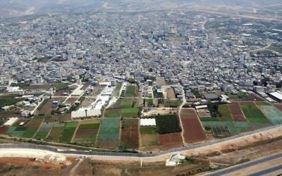 The Palestinian city of Qalqilya (top) and the Israeli security barrier (bottom), file photo (AP Photo/Lefteris Pitarakis)