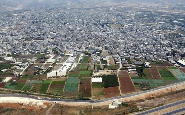 The Palestinian city of Qalqilya (top) and the Israeli security barrier (bottom), file photo (AP Photo/Lefteris Pitarakis) The Palestinian city of Qalqilya (top) and the Israeli security barrier (bottom), file photo (AP Photo/Lefteris Pitarakis)
