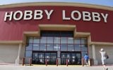 Customers walk to a Hobby Lobby store in Oklahoma City, June 30, 2014. (AP Photo/Sue Ogrocki)