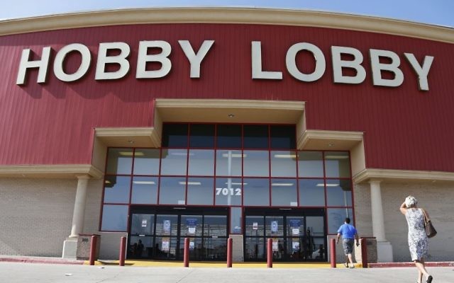 Customers walk to a Hobby Lobby store in Oklahoma City, June 30, 2014. (AP Photo/Sue Ogrocki)