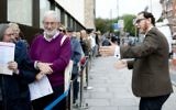 Chief executive Raymond Simonson greeting visitors at the opening of London’s JW3 community center in 2013. (Blake Ezra Photography via JTA)