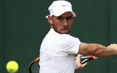 Israel's Dudi Sela returns to Bulgaria's Grigor Dimitrov during their Men's Singles Match on day six of the Wimbledon Tennis Championships at The All England Lawn Tennis and Croquet Club, in London, Saturday, July 8, 2017. (Gareth Fuller/PA via AP)