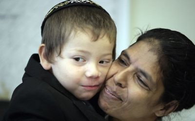 Moshe Holtzberg, an Israeli child whose parents were killed it the Mumbai attack, with his Indian nanny Sandra Samuel on August 18, 2010. (Abir Sultan/Flash 90) Moshe Holtzberg, an Israeli child whose parents were killed it the Mumbai attack, with his Indian nanny Sandra Samuel on August 18, 2010. (Abir Sultan/Flash 90)