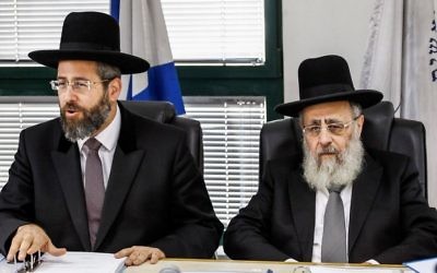 Chief Ashkenazi Rabbi David Lau (L) and Sephardi Chief Rabbi Yitzhak Yosef attend a meeting of the Rabbinate Council in Jerusalem on November 4, 2013. (Flash90) Chief Ashkenazi Rabbi David Lau (L) and Sephardi Chief Rabbi Yitzhak Yosef attend a meeting of the Rabbinate Council in Jerusalem on November 4, 2013. (Flash90)