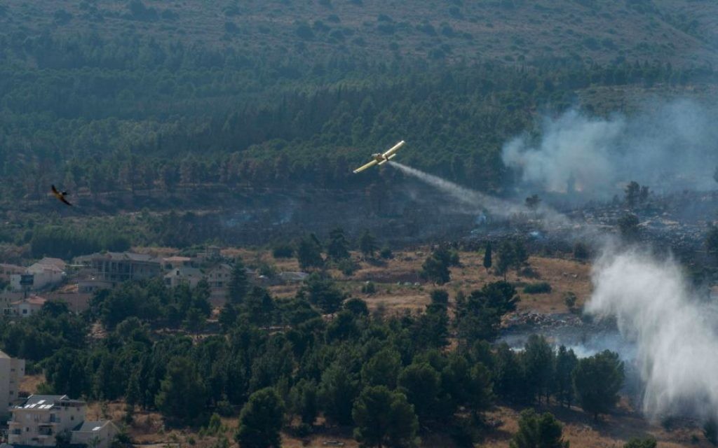 Illustrative photo of firefighter planes extinguishing a fire on July 19, 2015. (Basel Awidat/Flash90)