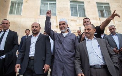The leader of the Northern Branch of the Islamic Movement in Israel, Sheikh Raed Salah (center), marches with his supporters outside the Jerusalem District Court on October 27, 2015, where he received a sentence of eleven months in prison for incitement to violence and racism against Jews. (Yonatan Sindel/Flash90) The leader of the Northern Branch of the Islamic Movement in Israel, Sheikh Raed Salah (center), marches with his supporters outside the Jerusalem District Court on October 27, 2015, where he received a sentence of eleven months in prison for incitement to violence and racism against Jews. (Yonatan Sindel/Flash90)