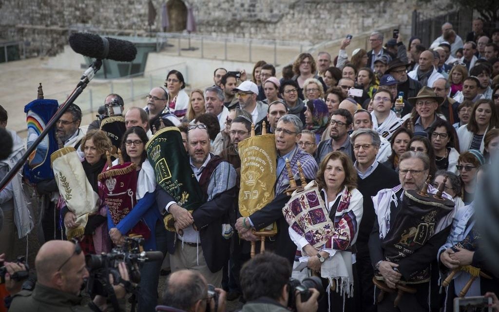 A group of American Conservative and Reform rabbis and the Women of the Wall movement members hold Torah scrolls during a protest march against the government’s failure to deliver a new prayer space, at the Western Wall in Jerusalem Old City, November 2, 2016. (Hadas Parush/Flash90) A group of American Conservative and Reform rabbis and the Women of the Wall movement members hold Torah scrolls during a protest march against the government’s failure to deliver a new prayer space, at the Western Wall in Jerusalem Old City, November 2, 2016. (Hadas Parush/Flash90)