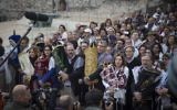 A group of American Conservative and Reform rabbis and the Women of the Wall movement members hold Torah scrolls during a protest march against the government’s failure to deliver a new prayer space, at the Western Wall in Jerusalem Old City, November 2, 2016. (Hadas Parush/Flash90)