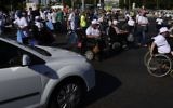Illustrative: Disabled activists attend a protest calling for better health care in Tel Aviv on June 13, 2017. (Tomer Neuberg/Flash90)