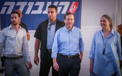 Labor party leader Isaac Herzog arrives with his wife Michal to casts his vote at a polling station in Tel Aviv on July 4, 2017.(Miriam Alster/Flash90)