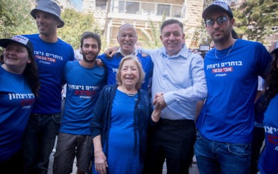 Labour party candidate Avi Gabbay seen with supporters outside a polling station in Jerusalem on July 4. 2017. (Yonatan Sindel/Flash90)