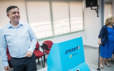 Labor party candidate Avi Gabbay casts his vote at a polling station in Jerusalem on July 4. 2017. (Yonatan Sindel/Flash90)