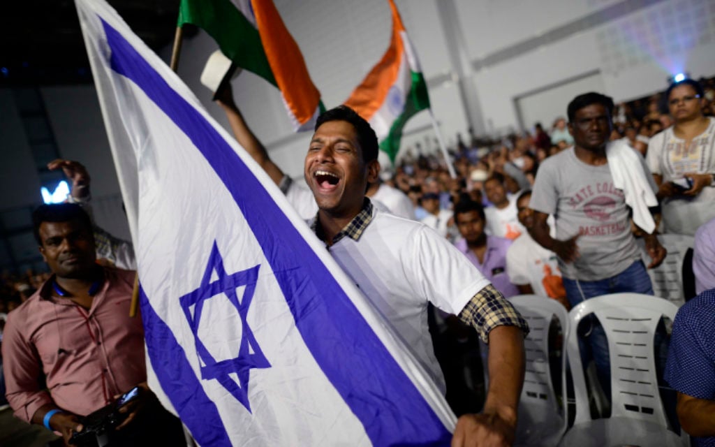 Members of the Indian community in Israel celebrate during an event marking 25 years of good relations between Israel and India during the official visit of the Indian Prime Minister Narendra Modi, at the Convention Center in Tel Aviv, on July 5, 2017. (Tomer Neuberg/Flash90)
