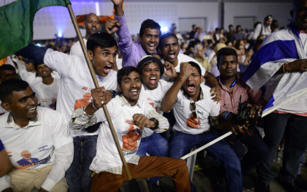 Members of the Indian community in Israel celebrate during an event marking 25 years of good relations between Israel and India during the official visit of the Indian Prime Minister Narendra Modi, at the Convention Center in Tel Aviv, on July 5, 2017. (Tomer Neuberg/Flash90)