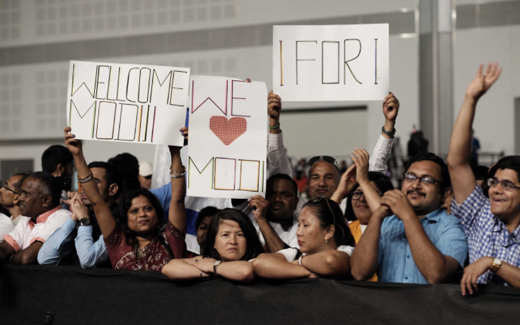 Members of the Indian community in Israel celebrate during an event marking 25 years of good relations between Israel and India during the official visit of the Indian Prime Minister Narendra Modi, at the Convention Center in Tel Aviv, on July 5, 2017. (Tomer Neuberg/Flash90)